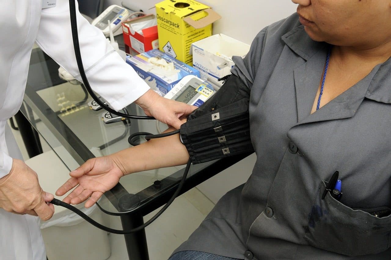 A blood pressure cuff being used during a primary care visit