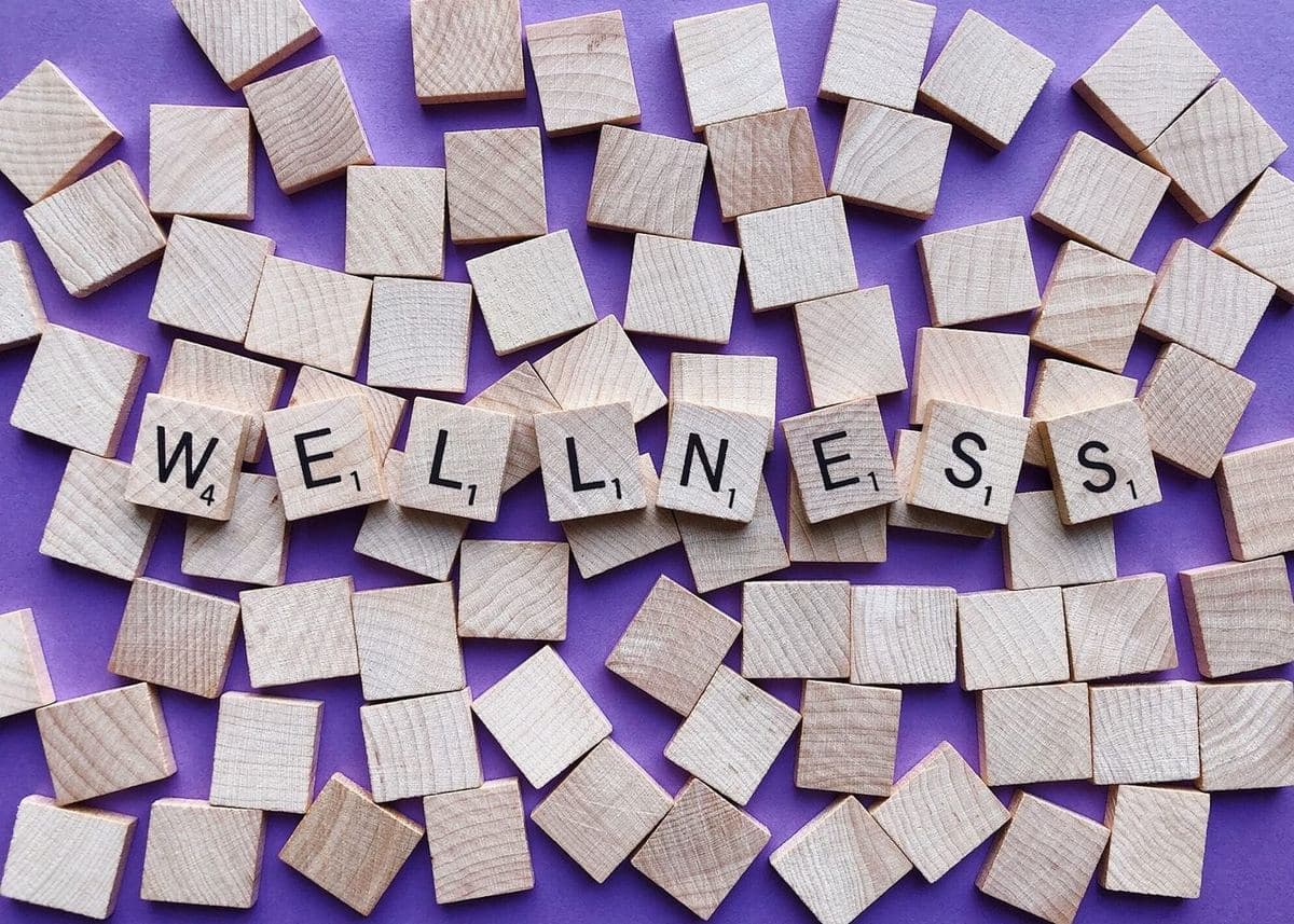 Lettered wooden tiles spelling out the word wellness